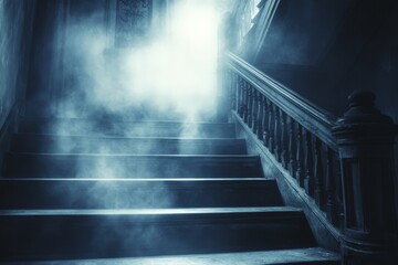 Fototapeta premium Eerie foggy stairway in a dark, abandoned building with a mysterious, glowing light at the top.