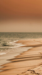 Obraz premium A lone person walking along the beach at sunset, AI