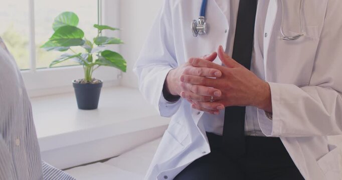 Close up shot of a doctor or nurse hands as they provide medical advice and talking to a patient during a clinic visit. Healthcare, showcasing the essential role of medicare and medical support.