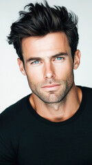 Fototapeta premium Confident man with tousled hair in black shirt