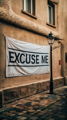 Fototapeta premium A banner hanging on a building that says 