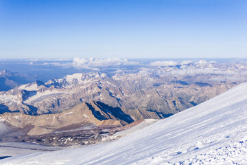 Naklejka premium mountain landscape, view from highland snow slope to green valleys, view from Mount Elbrus