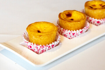 Delicious freshly baked egg tarts on a plate