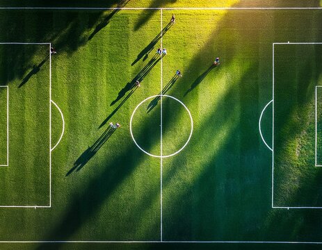 emerald pitch paradise lush soccer field from drone perspective perfect grass patterns dramatic stadium lights player shadows electric atmosphere