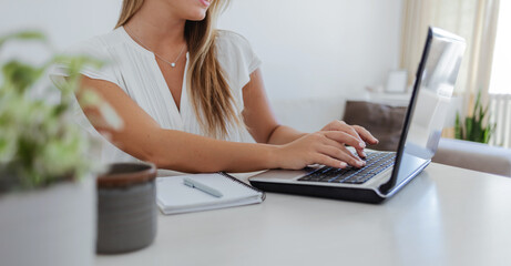 Laptop, research and business woman in office reading company budget, profit or revenue report....