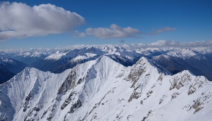 Obraz premium Majestic snowcapped mountains against a blue sky 12