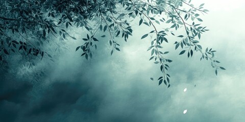 Obraz premium Abstract Green Branch with Falling Leaves Against a Foggy Background