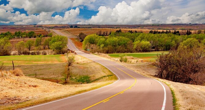 A highway traversing an agriculture area in the Oklahoma panhandle.
