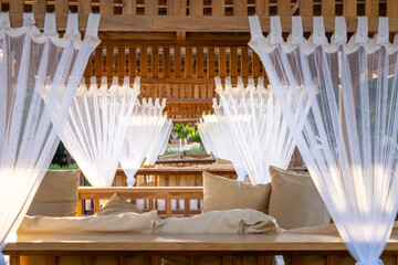 Sun beds with net curtains