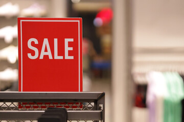 Red discount sign with blurred background. Discount signs to attract buyers' attention.