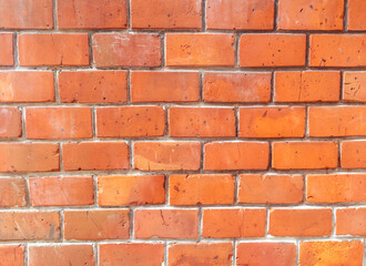Fototapeta premium A brick wall with a red brick color