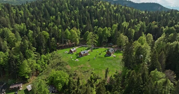 Scenic Aerial Shot of Mendola, Italy Alpine Village Nestled in the Forested Slopes of the Dolomites. High quality 4k footage