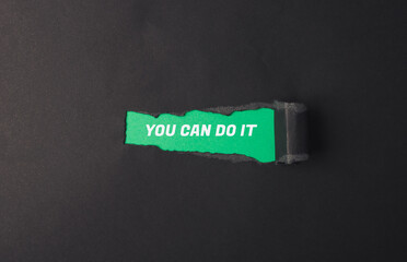 A torn piece of paper with the words You can do it written on it