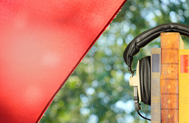 New audiobook releases for spring and summer holiday read  and listening  with row of books ang...