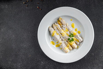white asparagus in cream sauce fresh meal food snack on the table copy space food background rustic top view
