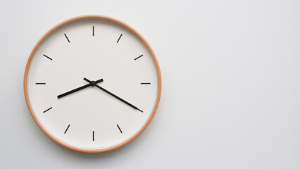 Minimalist wooden Wall Clock on White Wooden Surface with Space for Text – Time Set at 20.20,...