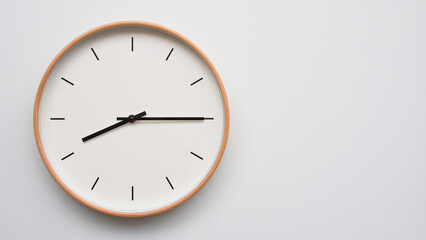 Minimalist wooden Wall Clock on White Wooden Surface with Space for Text – Time Set at 20.15, 08.15