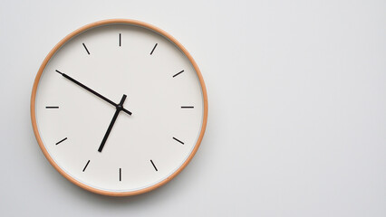 Minimalist wooden Wall Clock on White Wooden Surface with Space for Text – Time Set at 18.50/06.50