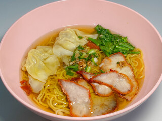 A captivating image of a bowl of noodles, beautifully presented with a variety of fresh ingredients and garnishes. The rich textures and vibrant colors make it an enticing visual for food enthusiasts