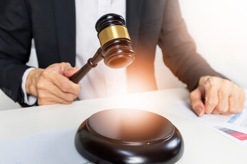 Judging conflicts and providing justice to people. ,Judge's Hammer in Judgment and Law,Litigation and legal action in business