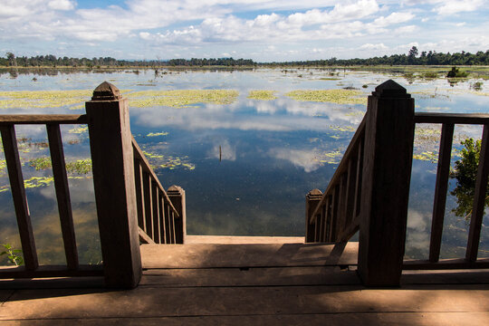PREAH KHAN, ANGKOR ARCHAEOLOGICAL PARK, SIEM REAP, CAMBODIA - NOVEMBER 16, 2016: Wooden dock at a large baray (man-made reservoir) on the East Gate of Preah Khan Temple.