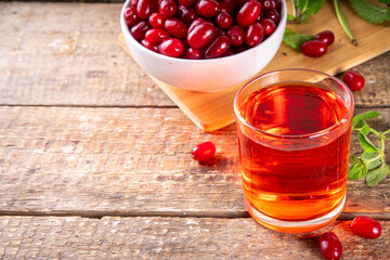 Cornelian cherry, dogwoods edible berry juice or liquor in glass