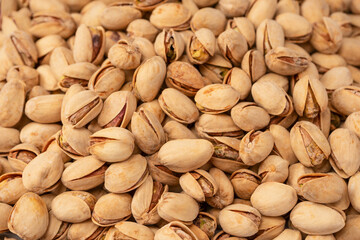 Tasty pistachios isolated on a white background.
