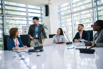 Man CEO talking on a meeting with his colleagues about business plan, future collaboration.