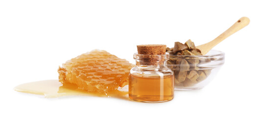 Natural honey tincture, propolis granules and sweet honeycomb isolated on white