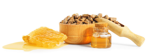 Natural honey tincture, propolis granules and sweet honeycomb isolated on white