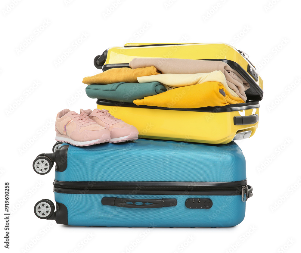 Sticker Two suitcases with sneakers and clothes isolated on white