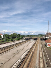 Naklejka premium A train station with a long track of train tracks