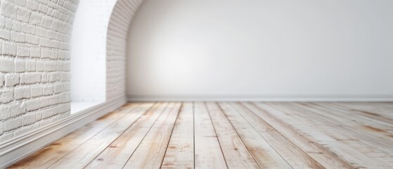  A room featuring a white brick wall on each side, one adorned with an arch The floor is of wooden material