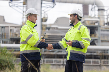 Oil engineers having a handshake for their success partnership