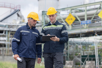 Petroleum engineers working at oil refinery site