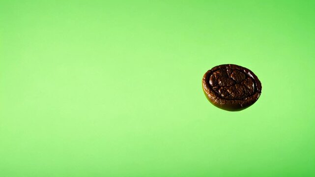 Coffee Bean Falling on a Green Screen