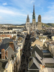 ROUEN, NORMANDIE, FRANCE -  2023: historic center, Great-Clock street, "Rue du Gros-Horloge" cobbled pedestrian shopping street, towards Notre-Dame Cathedral, seen from above, aerial view