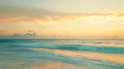 Obraz premium Blurry beach backdrop with yellow and blue sky at sunrise