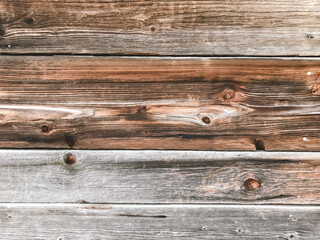 Fototapeta premium The image is of a wooden surface with a grainy texture