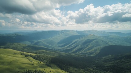 Naklejka premium A breathtaking aerial view of rolling green mountains, with lush forests and a cloudy sky above.