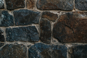 A wall made of stone with a blue and gray color