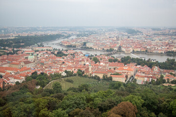 Obraz premium PETŘÍNSKÁ ROZHLEDNA, PRAGUE, CZECHIA - SEPTEMBER 12, 2014: View from the Petrin Tower, a 63m-tall lookout tower in Prague, resembling the Eiffel Tower and offering stunning city views from the top.