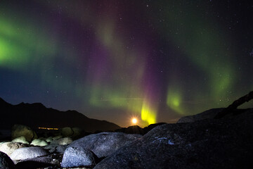 TROMSO, NORWAY - SEPTEMBER 18 2014: Northern lights seen on a cold autumn night in Tromsø, Norway...