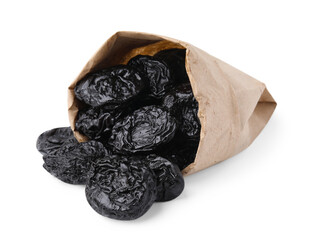 Paper bag with tasty dried plums (prunes) isolated on white