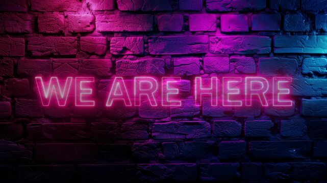 Video footage of Pink glowing We are here text neon on brick wall background. Looped Neon abstract Lines.