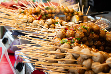 Grilled meatballs with dipping sauce, Thai street food that is famous all over the world.