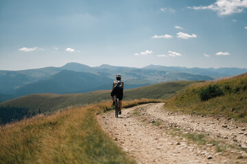 Gravel bikers on Transalpina strategic road in the Carpathian Mountains in Romania.