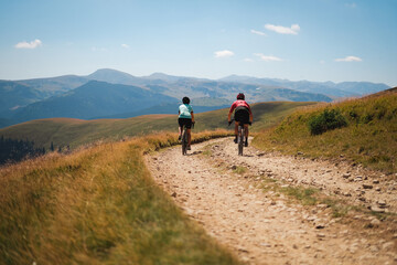 Gravel bikers on Transalpina strategic road in the Carpathian Mountains in Romania.