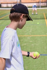 Two boys playing tennis on the local tennis court © Gosia