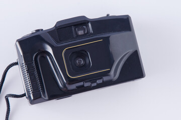 Old film camera on white background. Retro technology